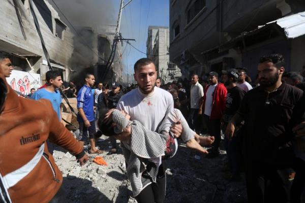 Palestinians rescue survivors after an Israeli strike on Rafah, Gaza Strip, Friday, Nov. 17, 2023. (AP Photo/Hatem Ali)