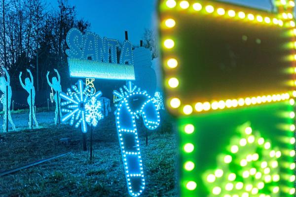 Christmas-themed cutouts and lights at Glow.